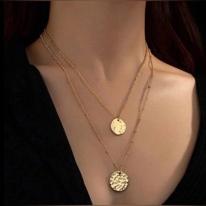 Disc charm layered necklace. New.